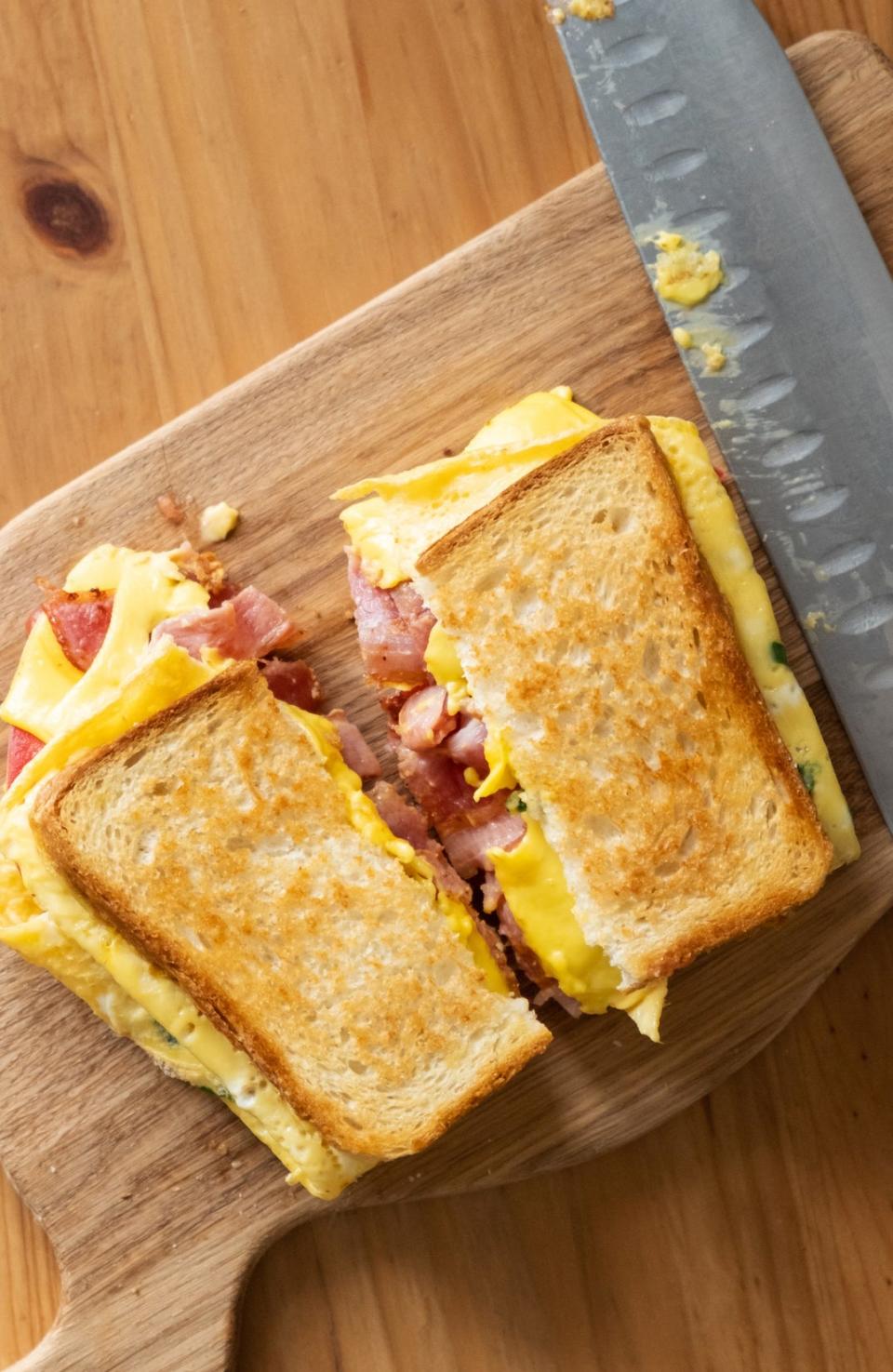 Breakfast sandwich with ham, eggs and cheese.