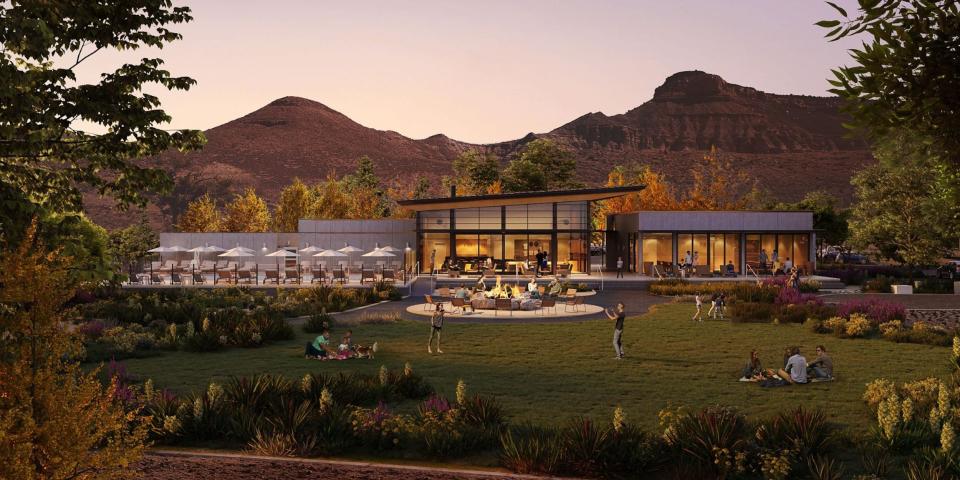 A rendering of Autocamp Zion at sunset. People are hanging out at the field.