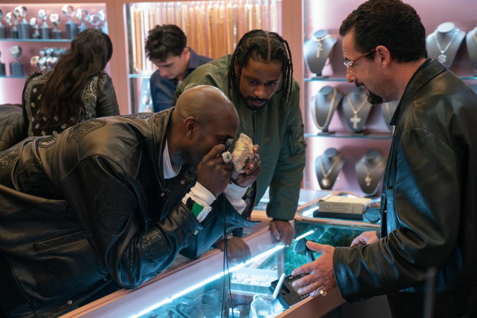 Basketball star Kevin Garnett, left, stars as himself alongside Lakeith Stanfield and Adam Sandler in "Uncut Gems."