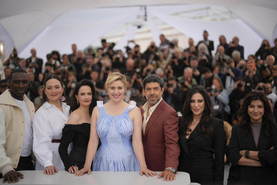 Jury president Greta Gerwig, center, poses with jury members Omar Sy, from left, Lily Gladstone, Eva Green, Pierfrancesco Favino, Nadine Labaki, and Ebru Ceylan during the jury photo call at the 77th international film festival, Cannes, southern France, Tuesday, May 14, 2024. (Photo by Andreea Alexandru/Invision/AP)