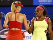 Serena Williams (R) of the U.S. shakes hands with Maria Sharapova of Russia after defeating her in their women's singles final match at the Australian Open 2015 tennis tournament in Melbourne January 31, 2015. REUTERS/Thomas Peter