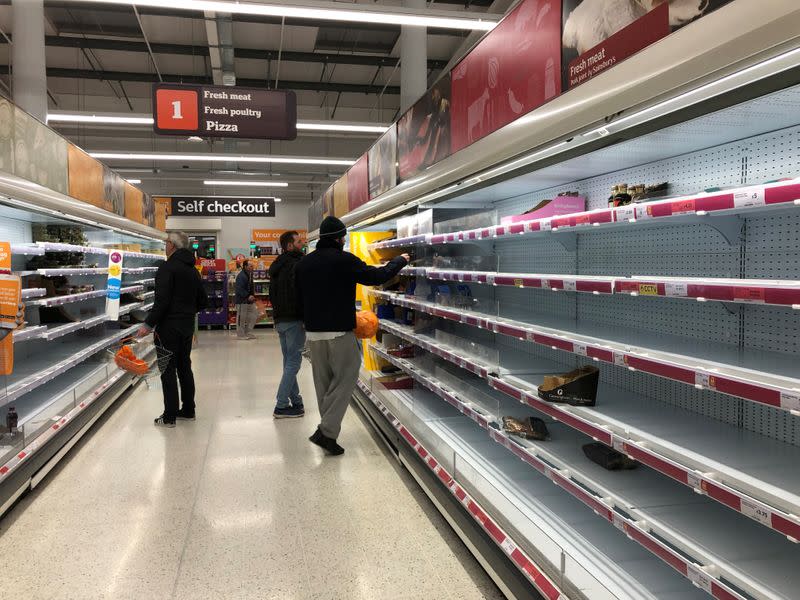 Empty shelves are seen at a Sainsbury's store in south London as the numbers of coronavirus cases continues to rise around the world