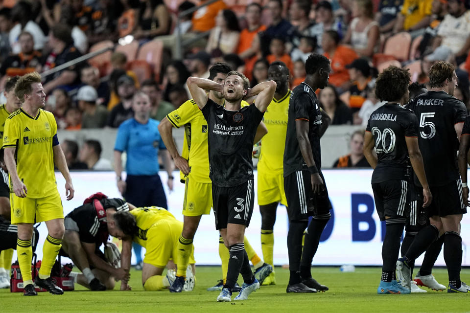 Houston Dynamo's Adam Lundqvist (3) reacts after being issued a red card during the first half of a soccer match against the Nashville SC Saturday, May 14, 2022, in Houston. (AP Photo/David J. Phillip)