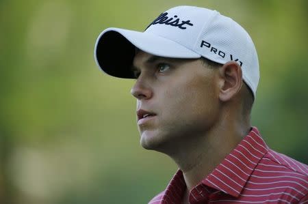 U.S. golfer Bill Haas walks to the 14th tee during the second round of the Masters golf tournament at the Augusta National Golf Club in Augusta, Georgia April 11, 2014. REUTERS/Mike Blake