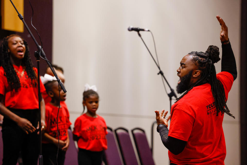 MLK Youth Mass Choir director Michael Connor conducts the music during the M.L.K. Youth and Young Adult Program on Saturday, Jan. 15, 2022 at the Lubbock Civic Center.