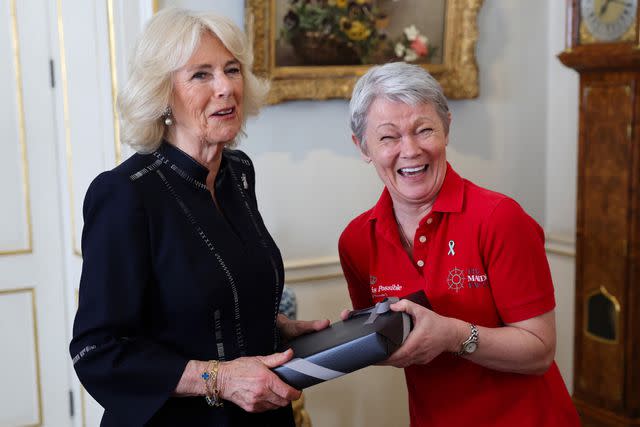 <p>CHRIS JACKSON/POOL/AFP via Getty</p> Queen Camilla and Tracy Edwards MBE at the Maiden yachting crew at Clarence House in London on April 29, 2024.
