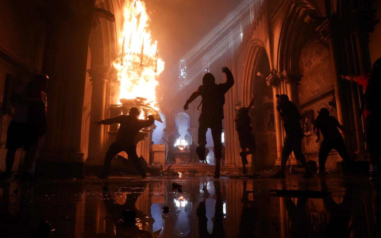 Protesters storm the San Francisco de Borja church - AP