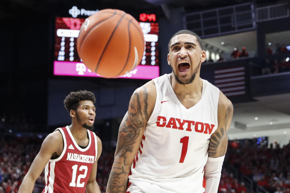 Dayton's Obi Toppin (1) reacts after dunking during the first half of an NCAA college basketball game against Massachusetts, Saturday, Jan. 11, 2020, in Dayton. (AP Photo/John Minchillo)