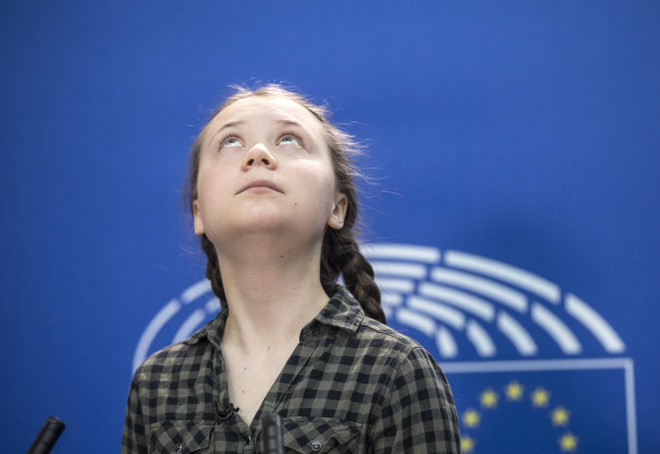 Swedish environmental activist Greta Thunberg looks up at the European Parliament in Strasbourg, Eastern France, Tuesday April 16, 2019. (AP Photo/Jean-Francois Badias)