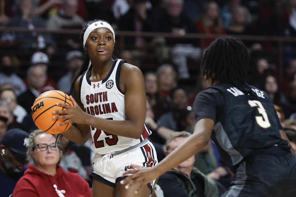 South Carolina guard Raven Johnson, left, looks to pass against Vanderbilt guard Jordyn Cambridge during the first half of an NCAA college basketball game in Columbia, S.C., Sunday, Jan. 28, 2024. (AP Photo/Nell Redmond)