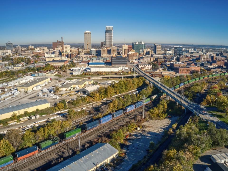 A view of Omaha Nebraska with railroad, railway, and skyscrapers