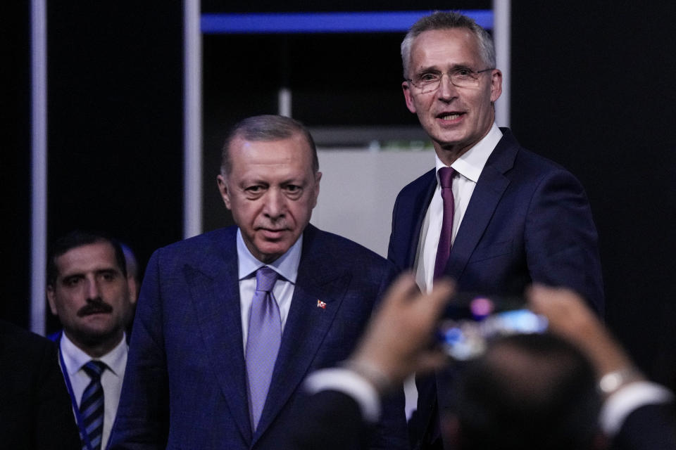 Turkish President Recep Tayyip Erdogan, second left, and NATO Secretary General Jens Stoltenberg before signing a memorandum in which Turkey agrees to Finland and Sweden's membership of the defense alliance in Madrid, Spain on Tuesday, June 28, 2022. North Atlantic Treaty Organization heads of state will meet for a summit in Madrid from Tuesday through Thursday. (AP Photo/Bernat Armangue)