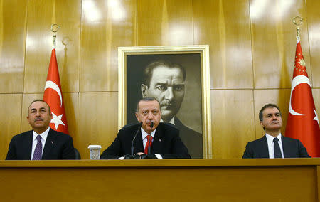 Turkish President Tayyip Erdogan, accompanied by Foreign Minister Mevlut Cavusoglu and Minister of European Union Affairs Omer Celik, speaks during a news conference at Ataturk International airport in Istanbul, Turkey March 26, 2018. Kayhan Ozer/Presidential Palace/Handout via REUTERS ATTENTION EDITORS - THIS PICTURE WAS PROVIDED BY A THIRD PARTY. NO RESALES. NO ARCHIVE.