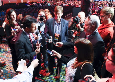 Governor of Louisiana Bobby Jindal (L) speaks to the press during the National Rifle Association's annual meeting in Nashville, Tennessee April 10, 2015. REUTERS/Harrison McClary