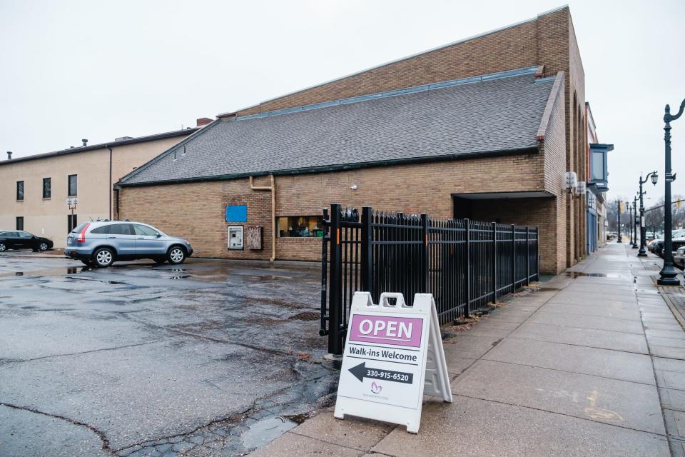 The newly opened Eva Women's Clinic has a sign board in front of its offices at 152 N. Broadway in New Philadelphia.