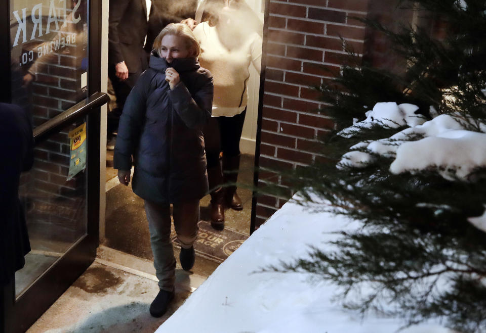 Potential Democratic presidential candidate Sen. Kirsten Gillibrand, D-N.Y., bundles up as she leaves an event organized by the Young Democrats of New Hampshire at Stark Brewing Co., Friday, Feb. 1, 2019, in Manchester, N.H. Gillibrand is making her first trip to New Hampshire as a presidential prospect. (AP Photo/Elise Amendola)