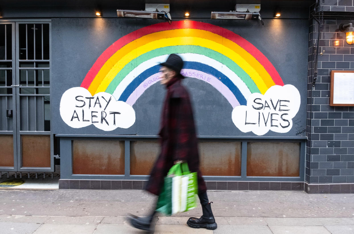  Pedestrian walks past a COVID-19 sign encouraging people to stay alert and save lives. Department of Health and Social Care recorded a total of 3,817,176 infections, 106,158 death and 1,673,936 recovered since the beginning of the outbreak. (Photo by May James / SOPA Images/Sipa USA) 