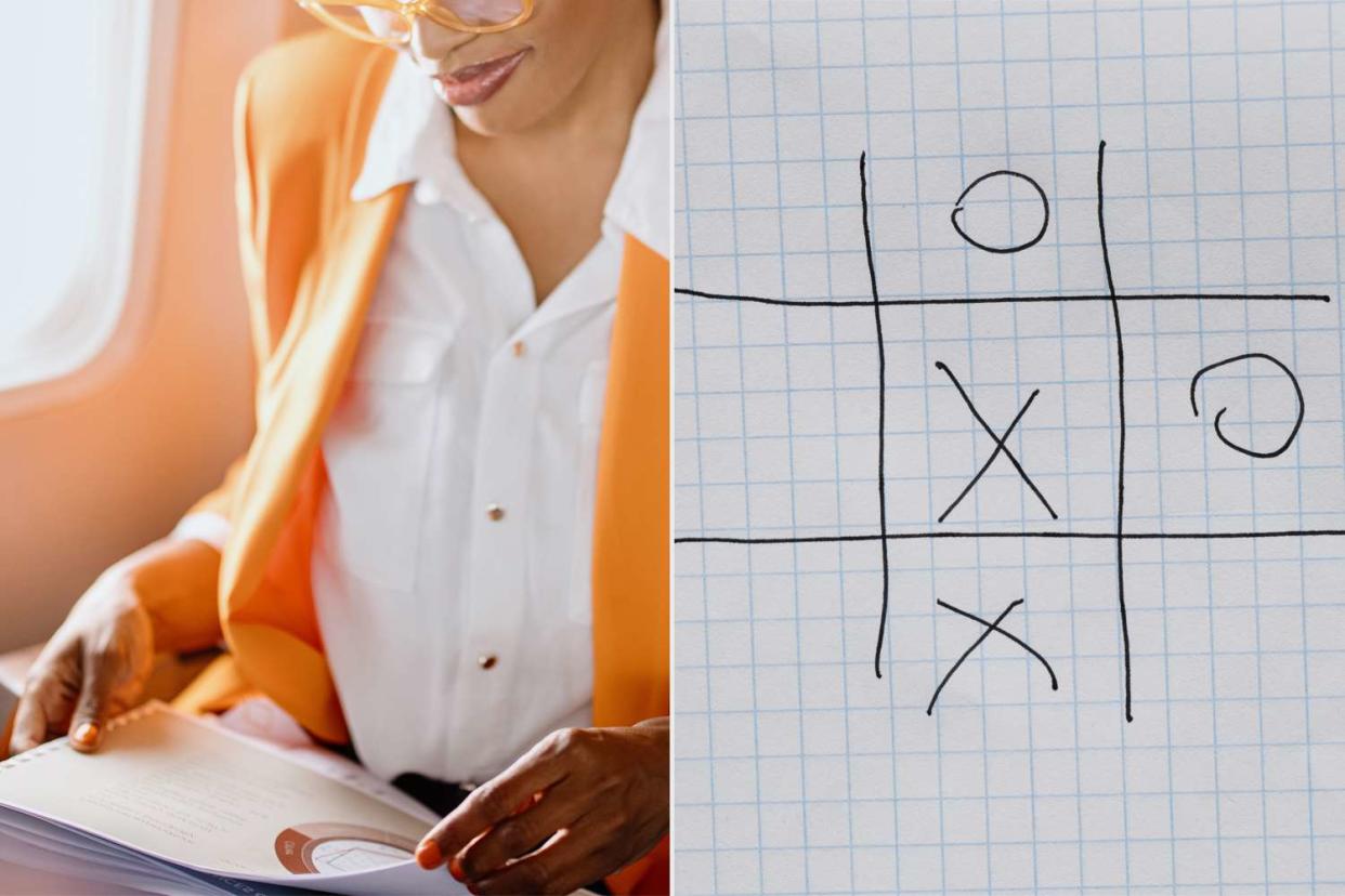 <p>Getty</p> Woman on airplane playing tic-tac-toe on an airplane. 