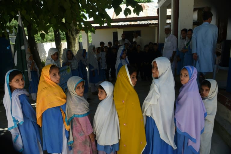 Hindko speaking Pakistani schoolchildren sing the national anthem at their school in Mansehra