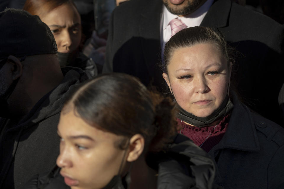 Katie Bryant, Daunte Wright's mom, looks at the crowd gathered outside the Hennepin County Government Center, Thursday, Dec. 23, 2021, in Minneapolis, after jurors found former suburban Minneapolis police officer Kim Potter guilty of first degree and second degree manslaughter in the death of motorist Daunte Wright. (AP Photo/Christian Monterrosa)