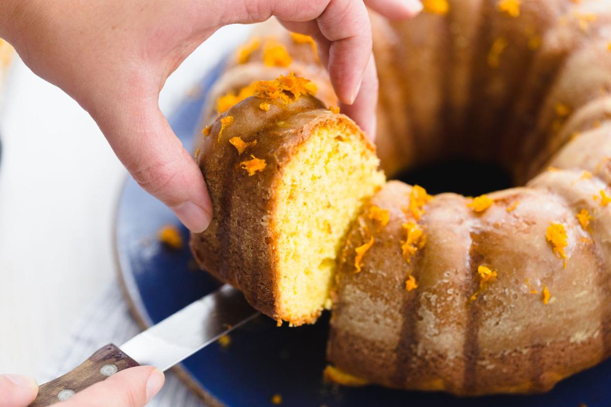 Orange cake sliced with zest.