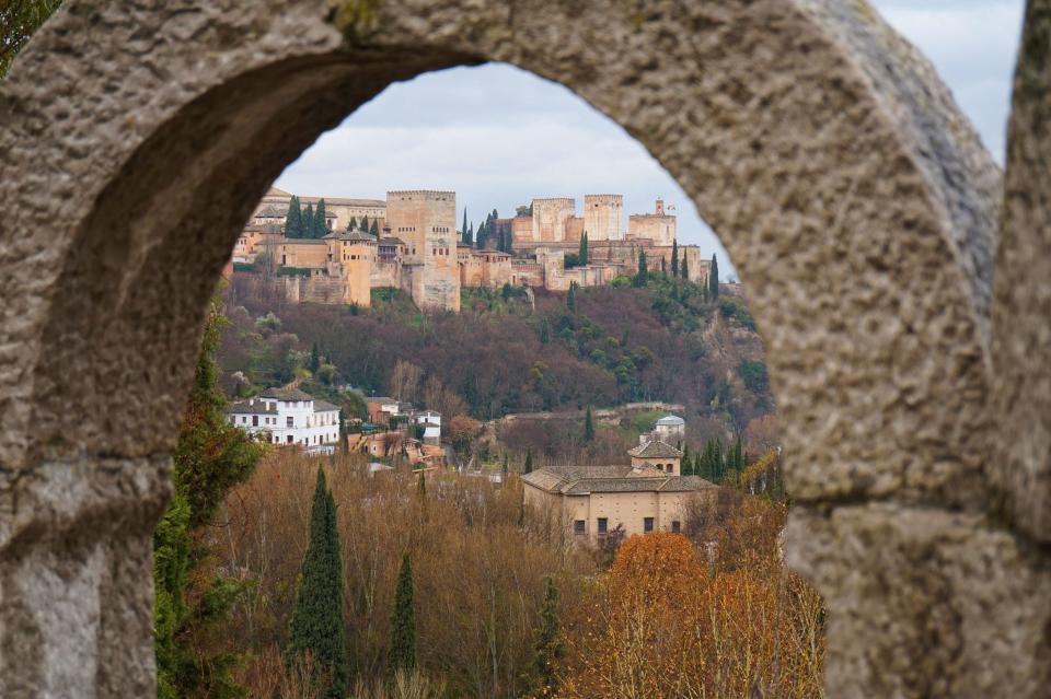 View of Grenada skyline through stone arch