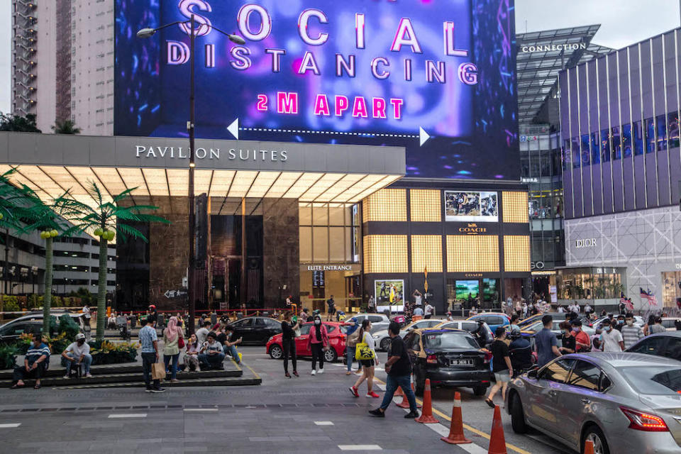 People are seen wearing protective masks as they walk along the Bukit Bintang shopping area, September 4, 2021. — Picture by Firdaus Latif