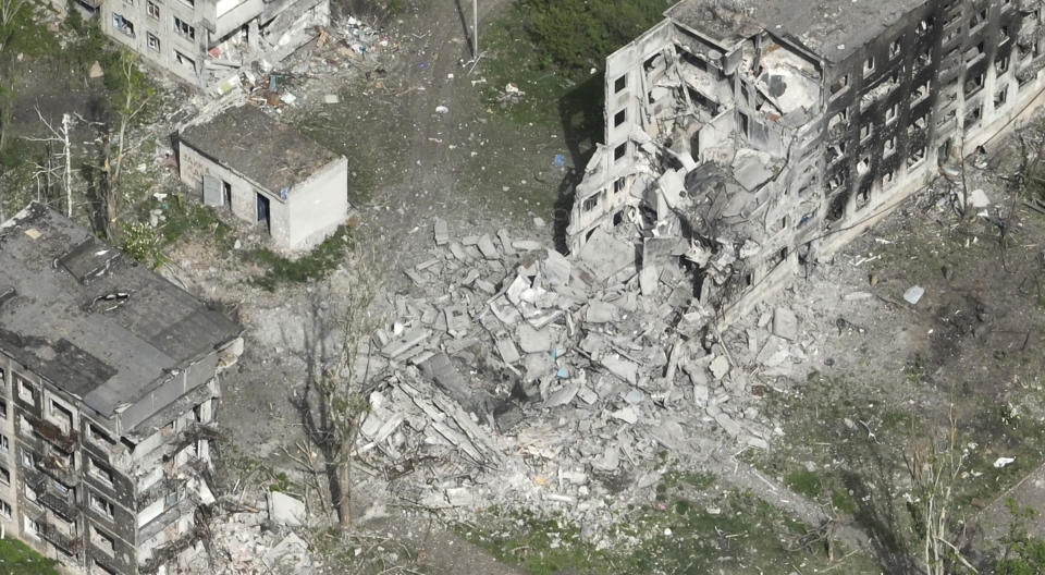 This photo taken from a drone video provided by Ukraine Patrol Police, shows devastation in Chasiv Yar, an eastern Ukrainian city Russia is assaulting, Ukraine, Monday, April 29, 2024. The footage shows the community of Chasiv Yar - which is set amid green fields and woodland - reduced to a skeletal ghost town with few residents left. The apocalyptic scene is reminiscent of the cities of Bakhmut and Avdiivka, which Ukraine yielded after months of bombardment and huge losses for the Kremlin’s forces. (Ukraine Patrol Police via AP)