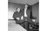 FILE - Junious "Buck" Buchanan lifts Dallas Texans coach Hank Stram as they engaged in a bit of horseplay after the big tackle from Grambling College in Louisiana signed a contract with the American Football League club, Dec. 1, 1962. The Kansas City Chiefs and their visionary coach, Hank Stram, realized more quickly than perhaps any team in the AFL or NFL that players from historically black colleges and universities were good.(AP Photo/FK)