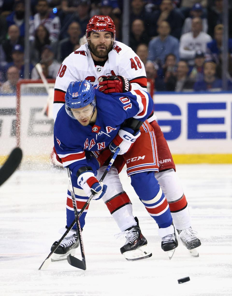 NEW YORK, NEW YORK - MAY 13: Jordan Martinook #48 of the Carolina Hurricanes checks Artemi Panarin #10 of the New York Rangers in Game Five of the Second Round of the 2024 Stanley Cup Playoffs at Madison Square Garden on May 13, 2024 in New York City.