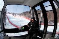 Heinz Haemmerle, or "Magic Heinzi" as US skier Lindsey Vonn calls her Austrian-born ski technician, sits in a gondola on his way to the women's second Olympic Downhill training at the Winter Olympics 2018 in Pyeongchang, South Korea February 19, 2018. Picture taken February 19, 2018. REUTERS/Leonhard Foeger