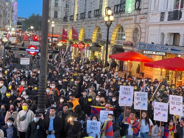 Hundreds of people from the Tibetan, Hong Kong and Uyghur communities protested in central London on Friday.