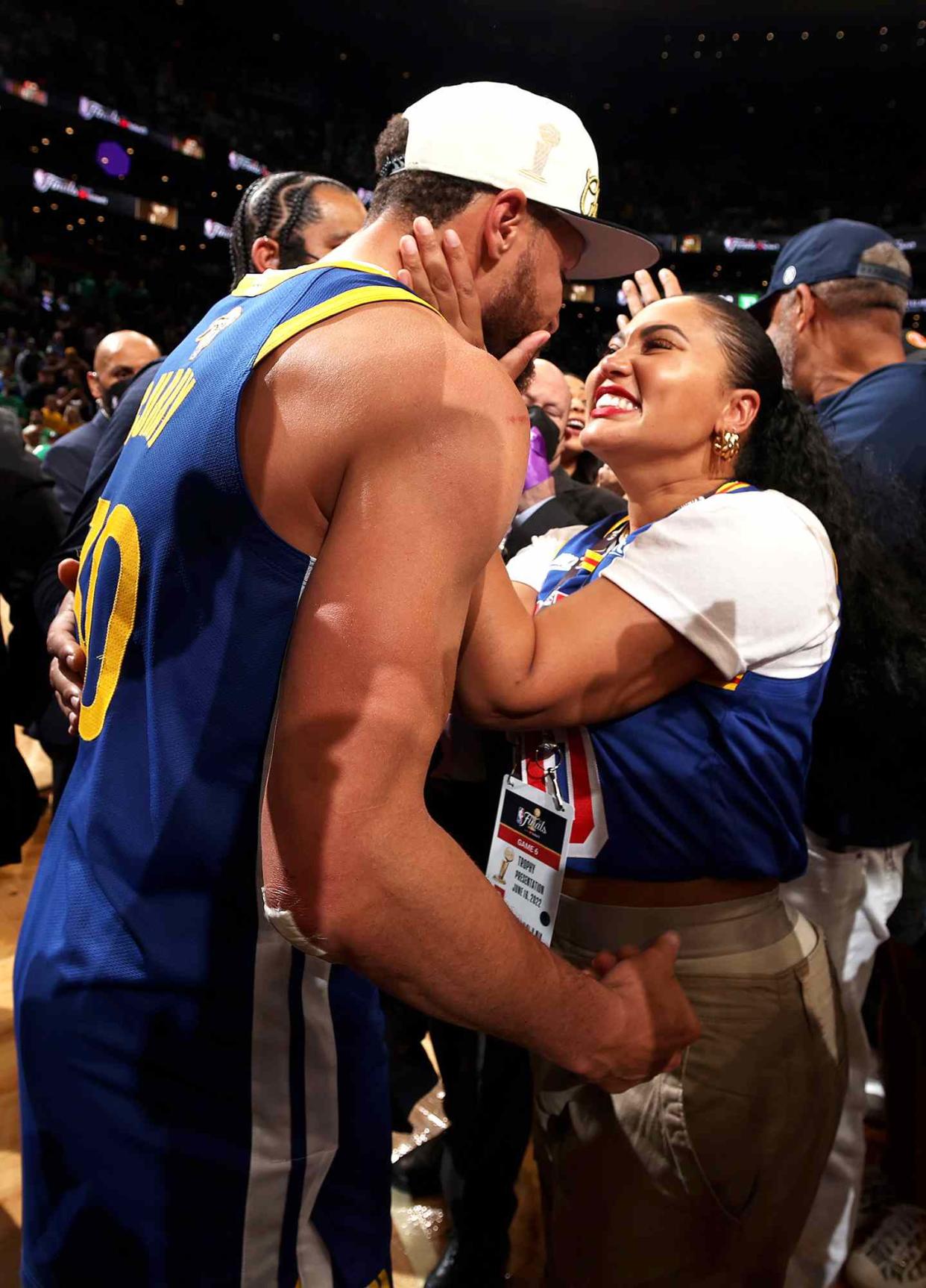 Stephen Curry #30 of the Golden State Warriors celebrates with Ayesha Curry