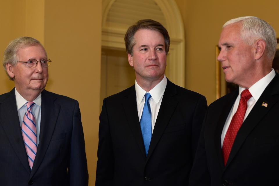 Senate Majority Leader Mitch McConnell of Ky., left, and Supreme Court nominee Brett Kavanaugh, center, listen as Vice President Mike Pence, right, speaks during a visit to Capitol Hill in Washington, Tuesday, July 10, 2018.