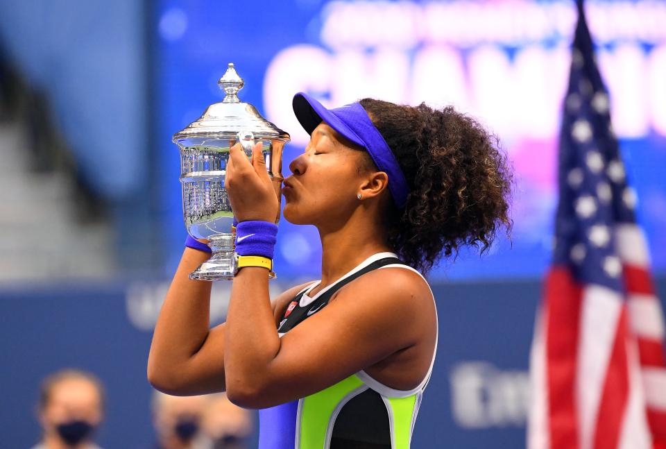 Naomi Osaka celebrates with the US Open trophy (USA TODAY Sports)