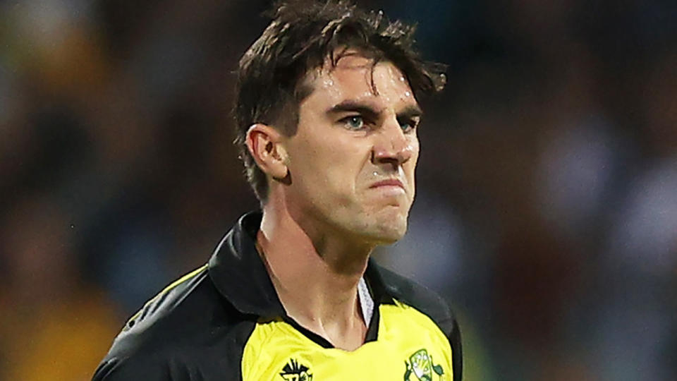 Pat Cummins is pictured grimacing during the T20 World Cup.