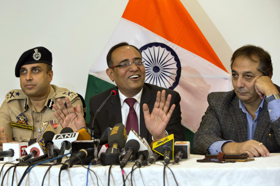 Government spokesperson Rohit Kansal, center, speaks as Swayam Prakash Pani, Inspector General of Police of Kashmir Range, left, and Divisional Commissioner Baseer Khan sit beside him during a press conference in Srinagar, Indian controlled Kashmir, Saturday, Oct. 12 2019. The Indian government on Saturday announced that all post paid mobile phone will be restored on Oct. 14, 70 days after a communication blockade was put in place in disputed Kashmir. (AP Photo/Dar Yasin)
