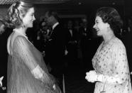 <p>A pregnant Cybill Shepherd wears a sheer flowing gown, that was quite daring for the time, to meet Queen Elizabeth II.</p>