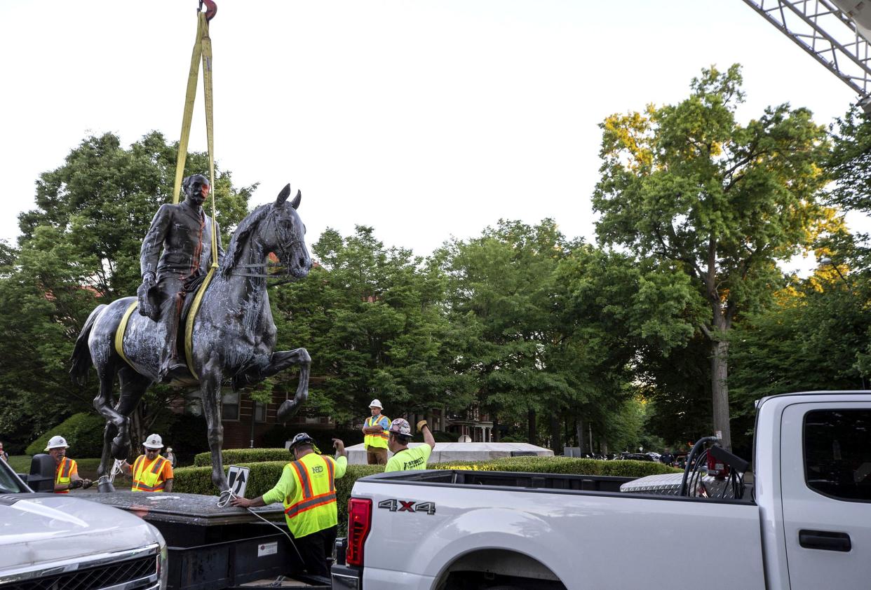 The John B. Castleman statue, in Louisville's Cherokee Triangle neighborhood, is removed on June 8, 2020 from its pedestal where it has stood for over 100 years. The statue was placed on a trailer after its removal.