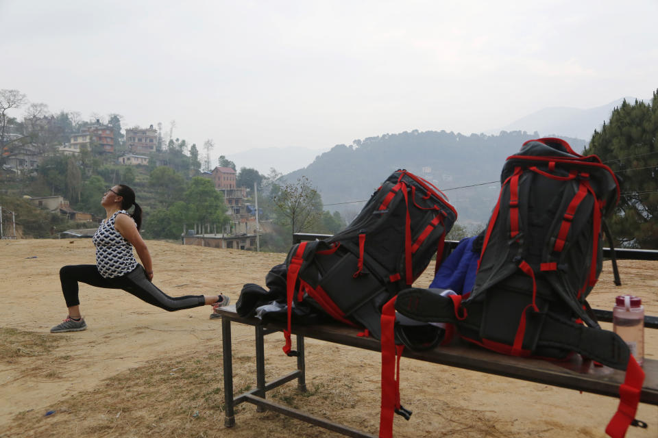 In this photo taken Saturday, March 30, 2019, Furdiki Sherpa, 43, performs morning exercises as she trains to summit Mount Everest, in Kathmandu, Nepal. Five years after one of the deadliest disasters on Mount Everest, three people from Nepal's ethnic Sherpa community, including Sherpa, are preparing an ascent to raise awareness about the Nepalese mountain guides who make it possible for hundreds of foreign climbers to scale the mountain and survive. Sherpa lost her husband in the 2014 ice avalanche on Everest’s western shoulder that killed 16 fellow Sherpa guides. (AP Photo/Niranjan Shrestha)