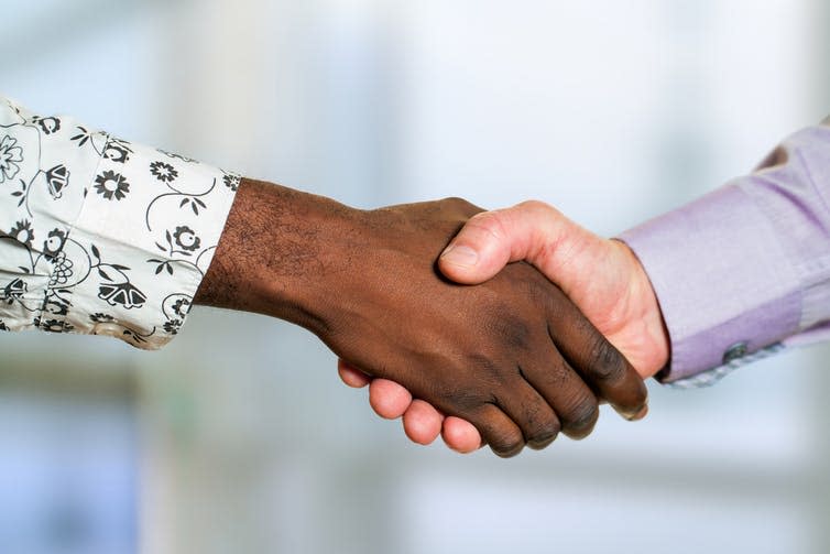 Black and white person shaking hands