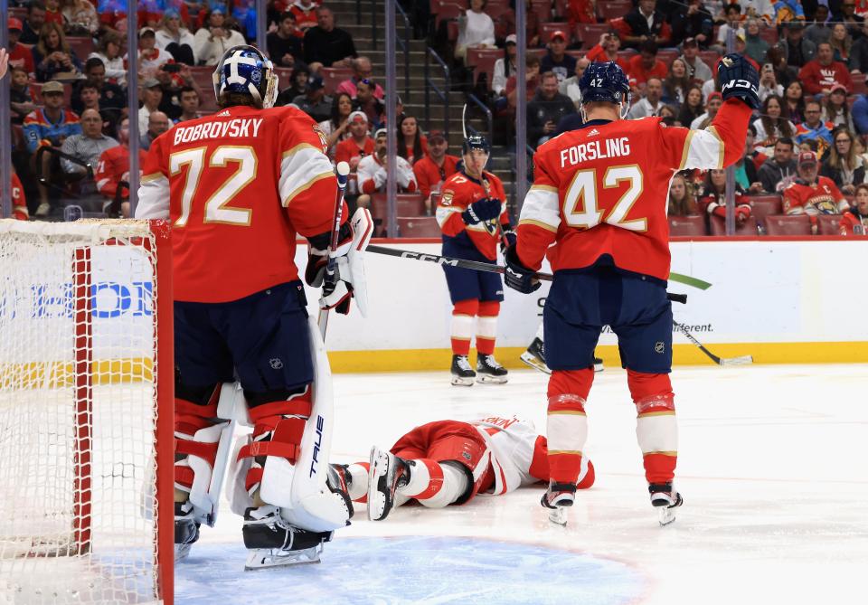 Dylan Larkin (71) of the Detroit Red Wings is injured during the first period against the Florida Panthers at Amerant Bank Arena on March 30, 2024 in Sunrise, Florida.