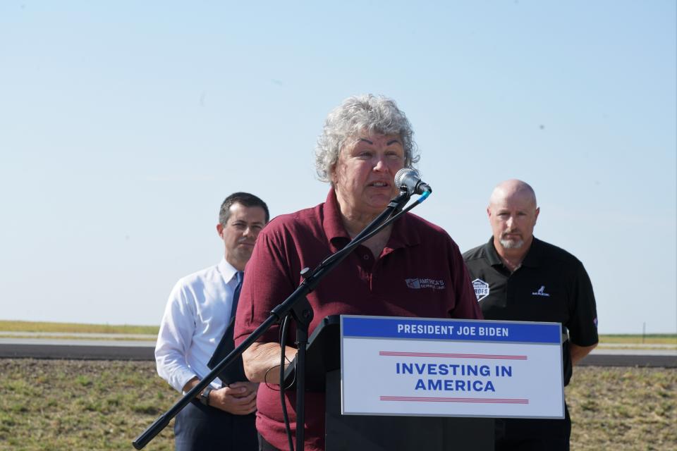 Carmen Anderson, a long-haul truck driver from Sioux Falls, introduces U.S. Transportation Secretary Pete Buttigieg at a press conference at a rest stop off of I-90 outside of Salem, SD, on Tuesday, Sept. 12, 2023.