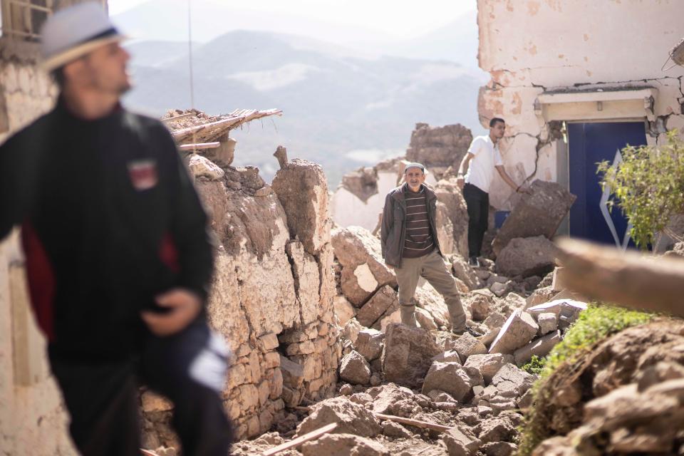 People inspect their damaged homes after an earthquake in Moulay Brahim village, near Marrakech, Morocco, Saturday, Sept. 9, 2023. A rare, powerful earthquake struck Morocco late Friday night, killing more than 1,000 people.