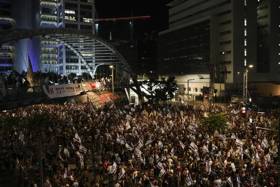 People protest against Israeli Prime Minister Benjamin Netanyahu's government and call for the release of hostages held in the Gaza Strip by the Hamas militant group, in Tel Aviv, Israel, Saturday, June 22, 2024. (AP Photo/Leo Correa)