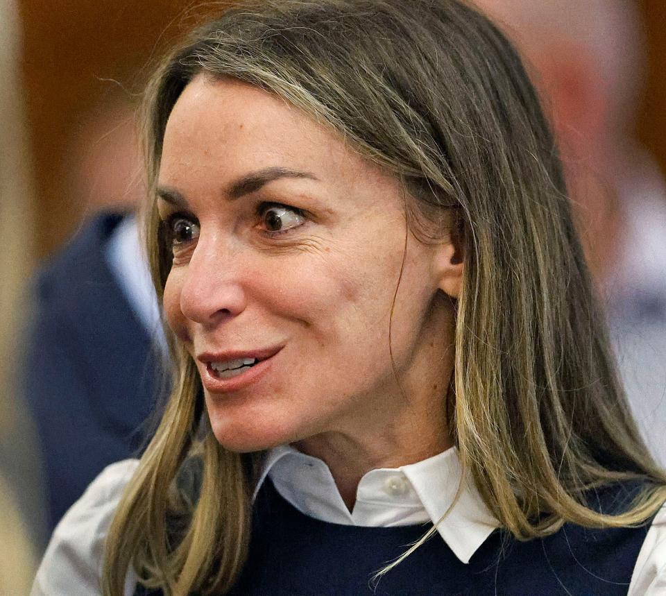 Karen Read reacts to her family during a break in her murder trail at Dedham Superior Court on Wednesday (AP)