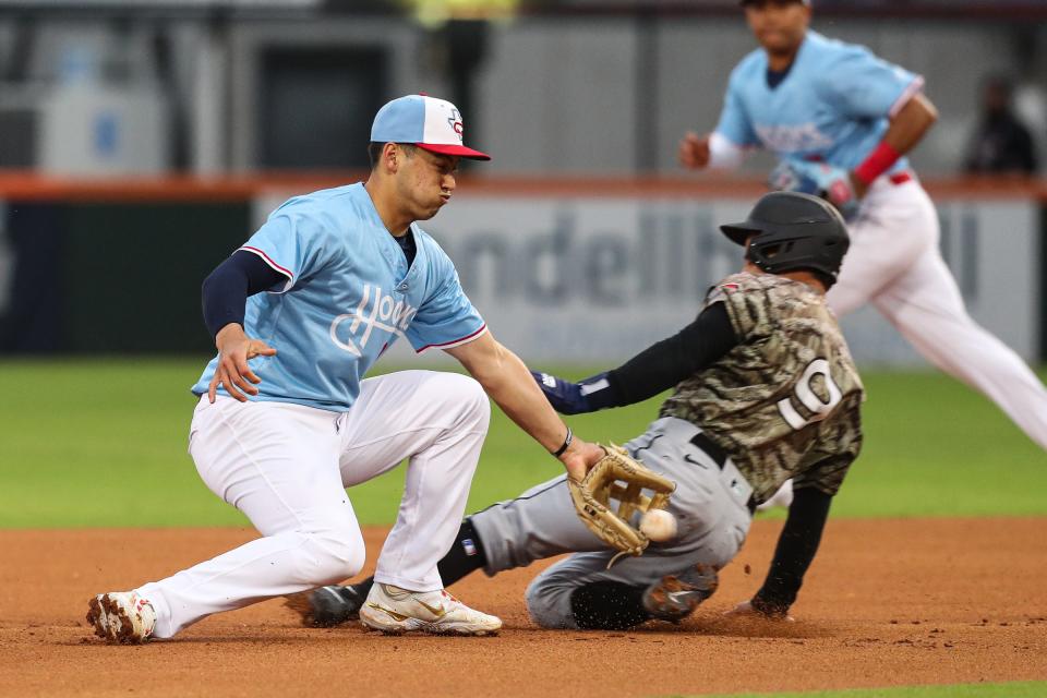 Hooks shortstop Shay Whitcomb attempts Arkansas Travelers Leo Rivas out at Whataburger Field on April 6, 2023. 