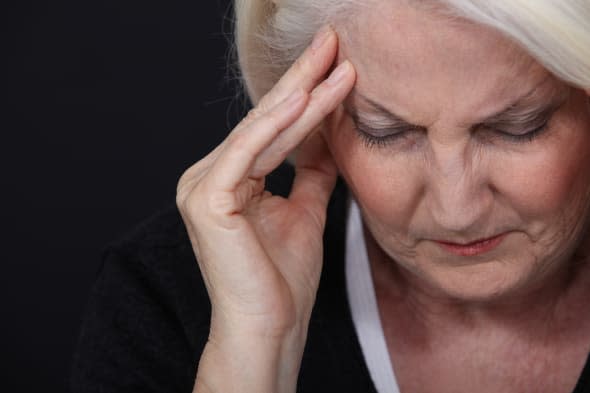 Senior woman having headache