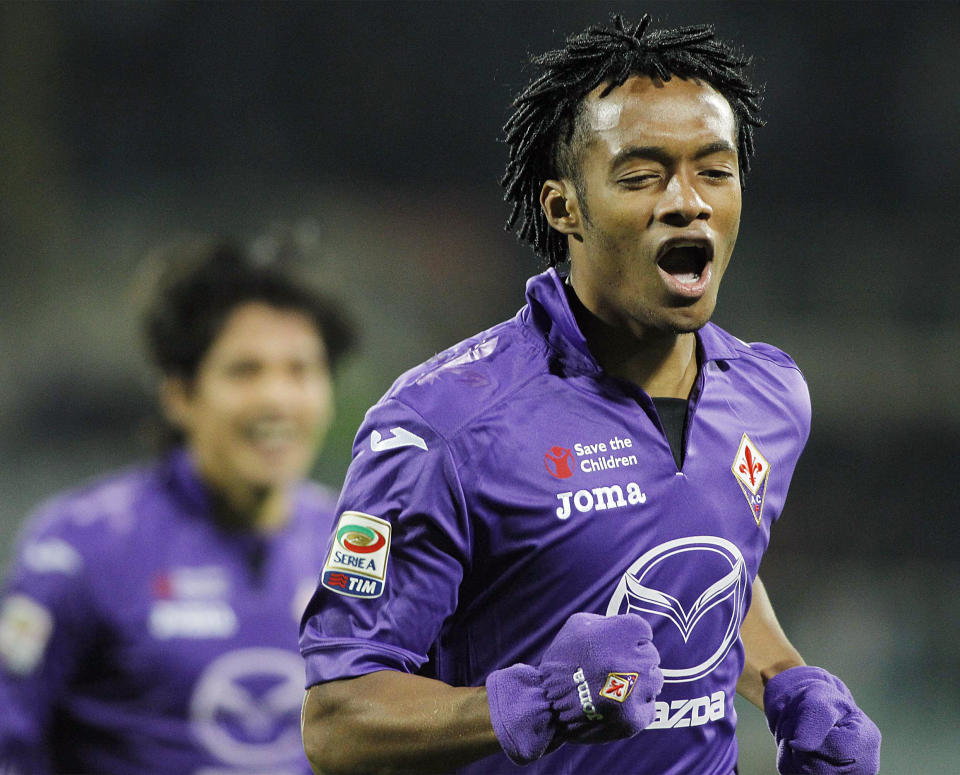Fiorentina's Juan Cuadrado celebrates after scoring during a Serie A soccer match between Fiorentina and Inter Milan, at the Artemio Franchi stadium in Florence, Italy, Saturday, Feb. 15, 2014. (AP Photo/Fabrizio Giovannozzi)