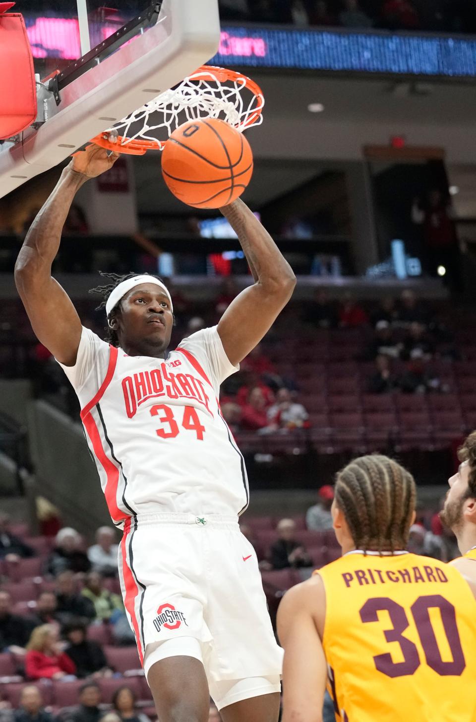 Nov 29, 2023; Columbus, OH, USA; Ohio State Buckeyes center Felix Okpara (34) scores in the first half of their game at at the Schottenstein Center.